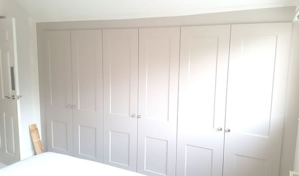 Fully bespoke 3x double wardrobes in Matt Cashmere and Cambridge Style doors.